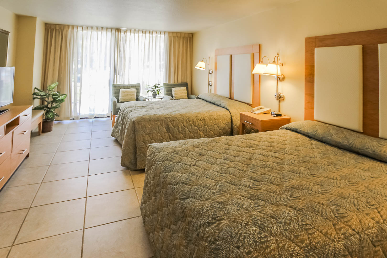 A spacious two bedroom with double beds at VRI's Royale Beach Tennis Club in Texas.